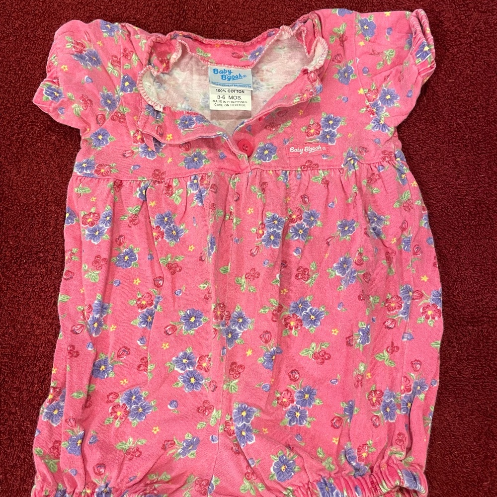 OshKosh's Baby B'gosh short sleeve infant one piece. Button front; snaps bottoms
